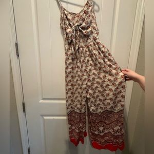 Patrons of peace romper size small, color is tan and red